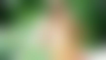 Annah Barnes holding her big round boobs.