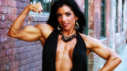 muscle MILF Marina Lopez flexing her bicep